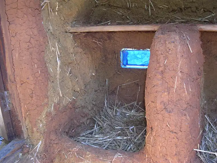 Nesting Box in the Chicken Coop with Straw Bedding
